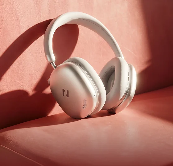 HAVIT audio headphones on a coral background
